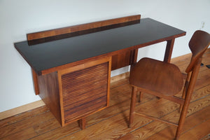 Vintage Mid Century Modern tambour door desk with black laminate top