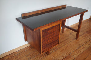 Vintage Mid Century Modern tambour door desk with black laminate top