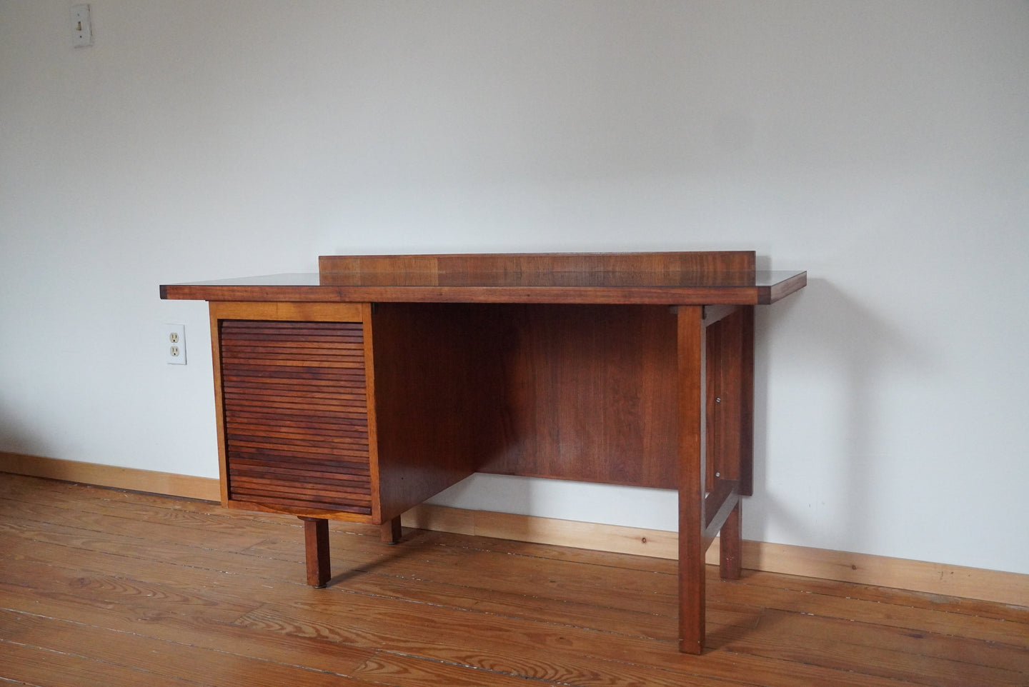 Vintage Mid Century Modern tambour door desk with black laminate top