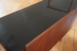 Vintage Mid Century Modern tambour door desk with black laminate top